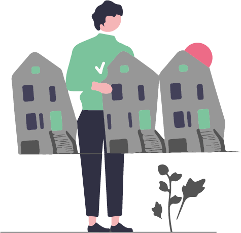 En person som står vid ett bord med minitayrer av bostadshus