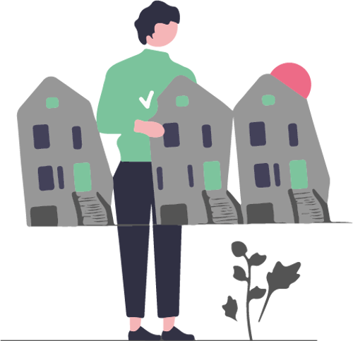 En person som står vid ett bord med minitayrer av bostadshus